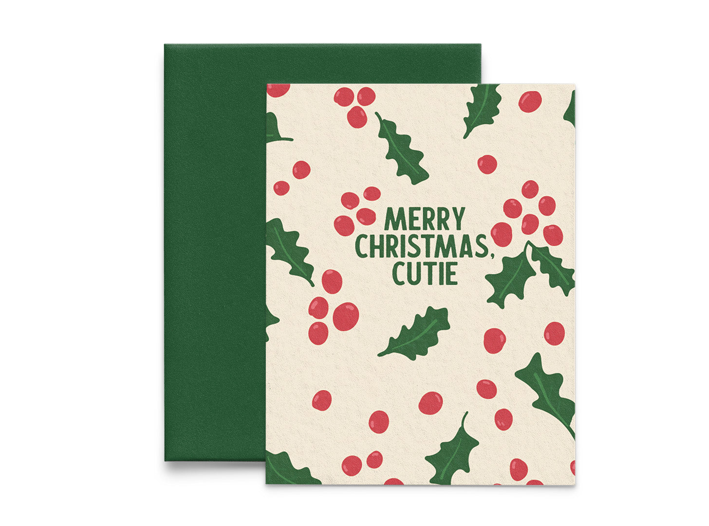 A greeting card with a Christmas design, featuring holly leaves and bright red berries on a cream background, with 'Merry Christmas, Cutie' text, and a green envelope.